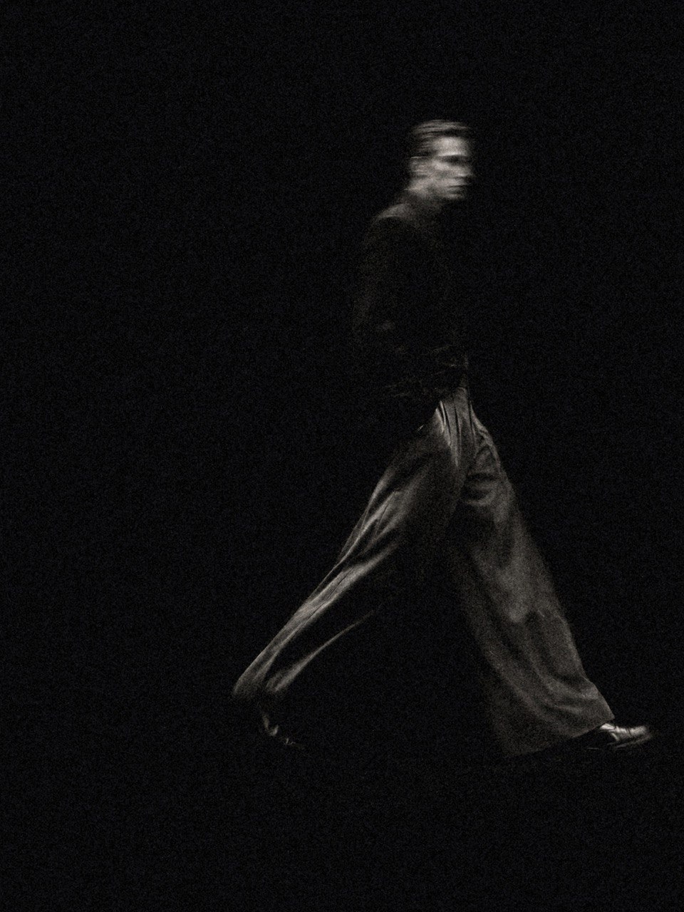Model walking in runway silhouette